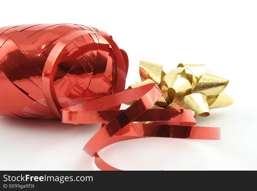 Gold gift ribbon on a white background