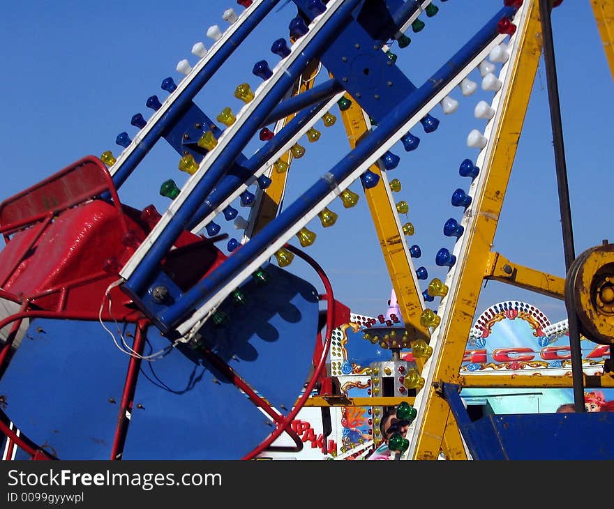 Seesaw on amusement park on sky background