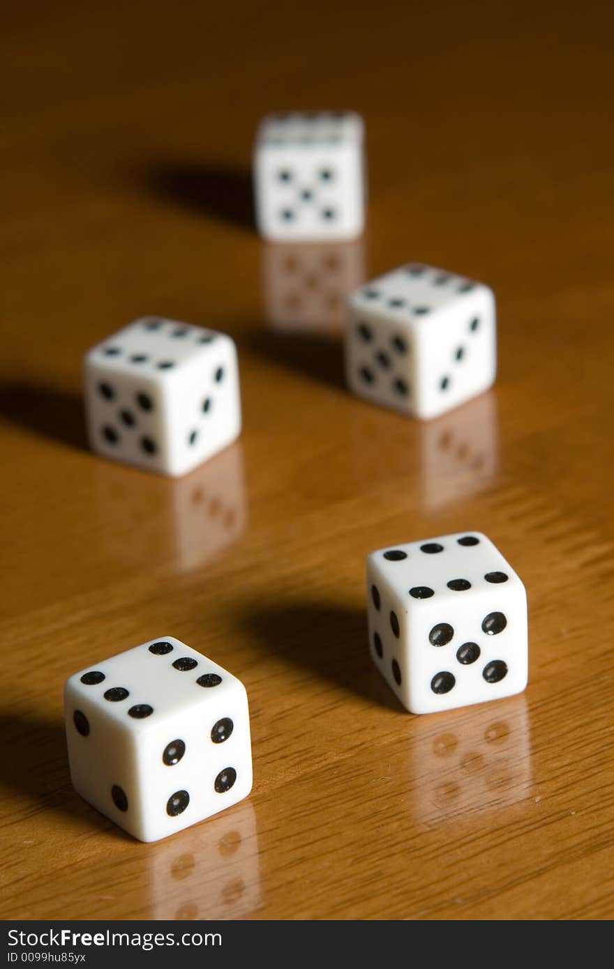 Five dices on a table