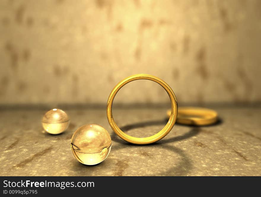 Image of Golden rings placed on a stony surface