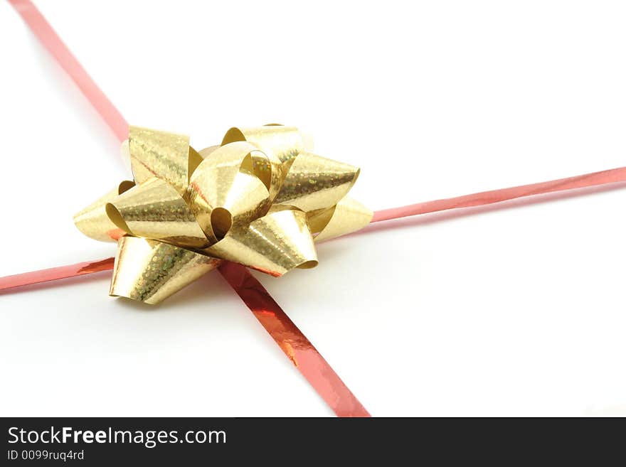 Gold gift ribbon on a white background