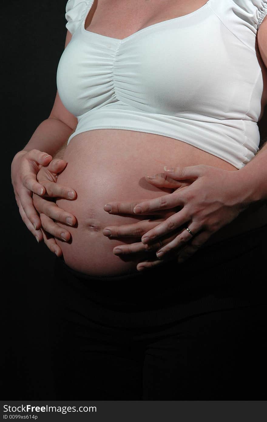 Pregnant woman and hands