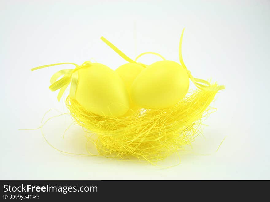 Yellow easter eggs on white background