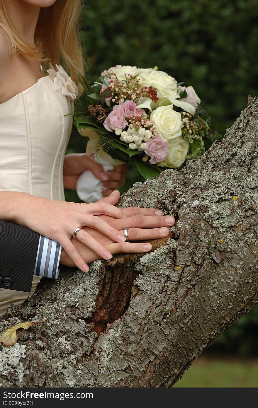 Hands, rings and bouquet