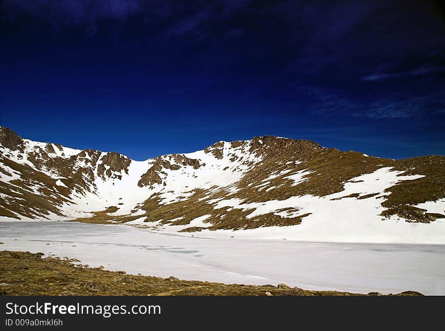 Colorado Mountain with snow against a blue sky. Colorado Mountain with snow against a blue sky