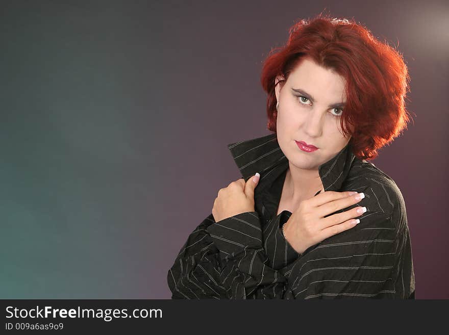 Girl with crossed arms in front of colored background