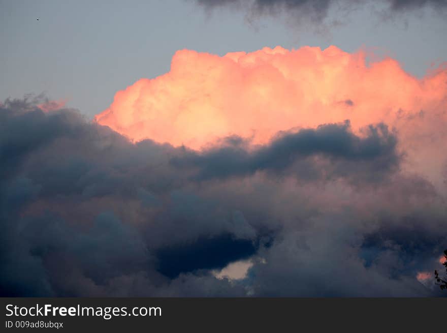 Clouds with orange color and blue sky