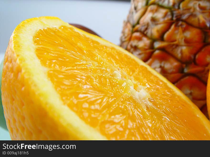 Orange and pine apple - exotic fruit. Orange and pine apple - exotic fruit