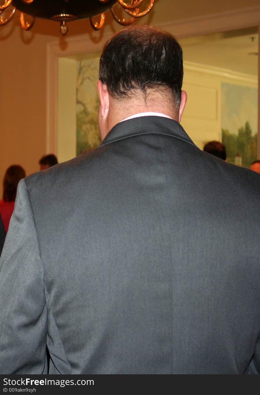 The back of a business man.