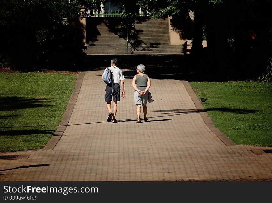 Old couple having a walk in botanical garden, brisbane, australia