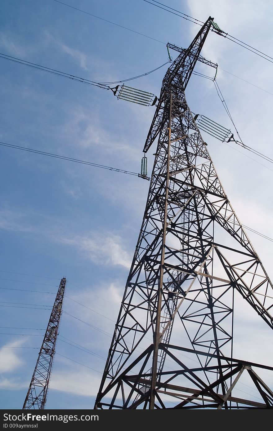 Support of a line of high-voltage transfers on a background of the dark blue sky