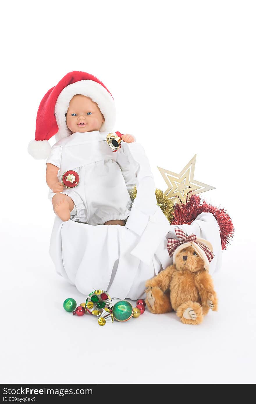 Basket filled with Christmas toys over white