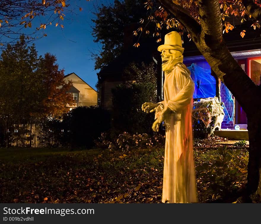 Halloween spook hanging in a neighbor's tree on Halloween night. Halloween spook hanging in a neighbor's tree on Halloween night.