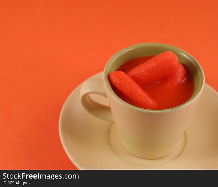 Carrots and juice in a cup