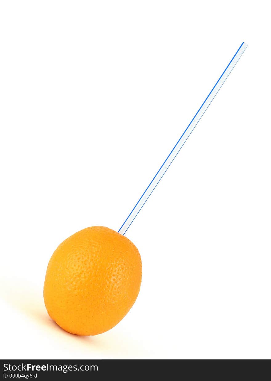 Drinking juice with a straw out of the whole orange. Drinking juice with a straw out of the whole orange