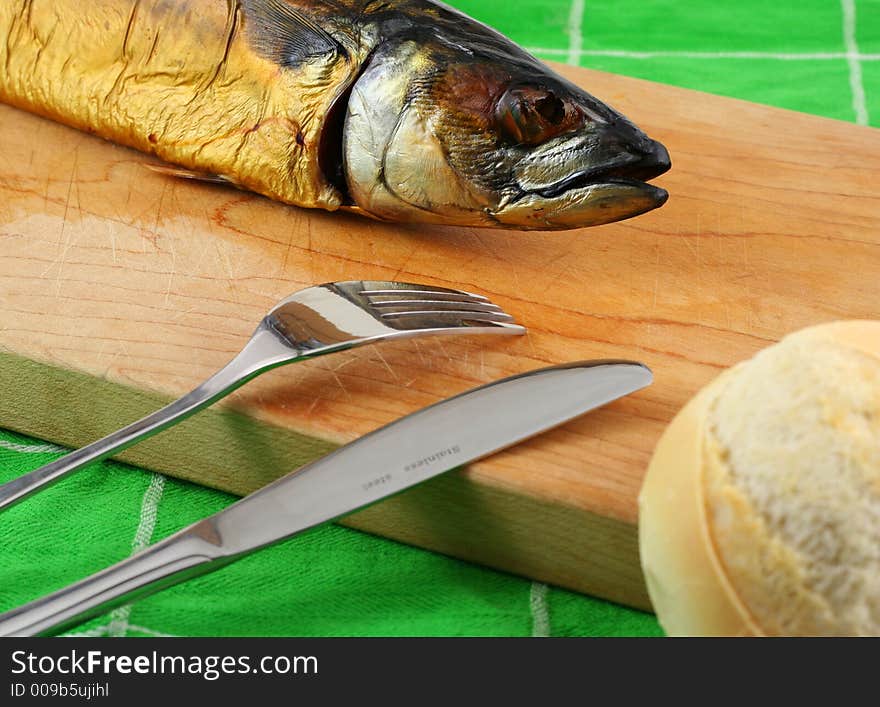 Smoked fish on cutting board