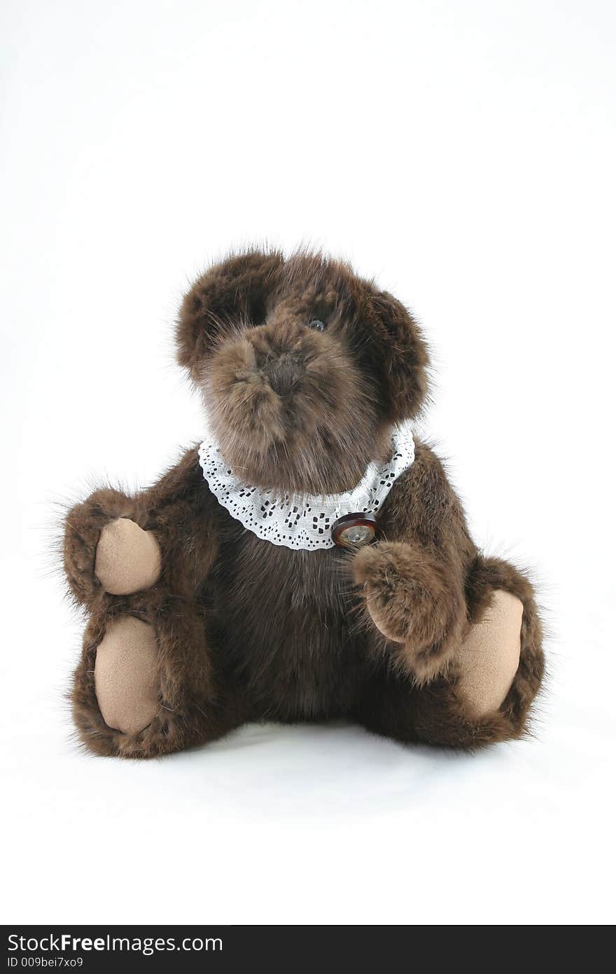 Furry antique teddy bear made from Grandma's old fur coat - isolated. Furry antique teddy bear made from Grandma's old fur coat - isolated