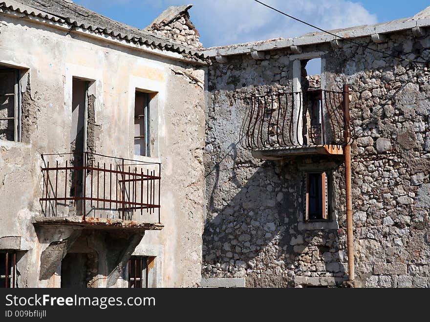 Damaged houses as a result of war and time. Damaged houses as a result of war and time