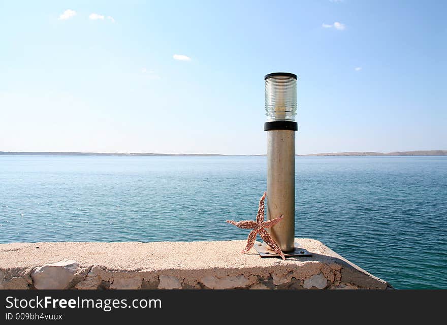 Harbour-detail with lamp and starfish. Harbour-detail with lamp and starfish