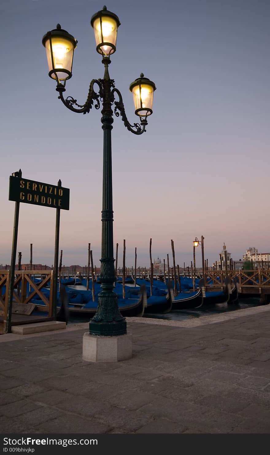 A row of Gondolas in Venice. A row of Gondolas in Venice