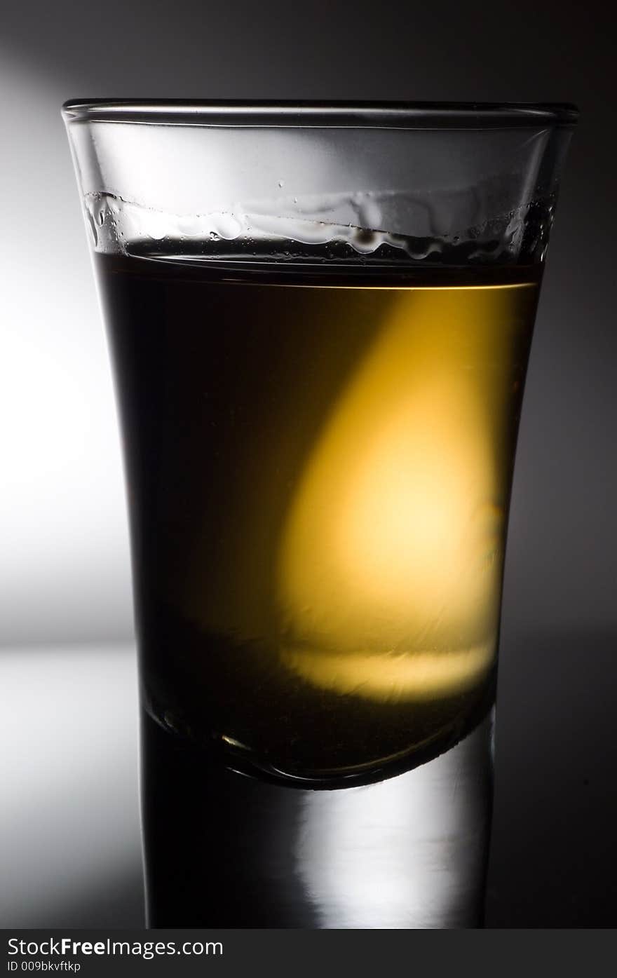 Close up shot of an amber whisky or liquor