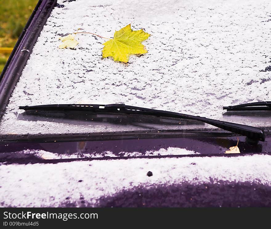 The late-autumn car covered by the first snow. The late-autumn car covered by the first snow