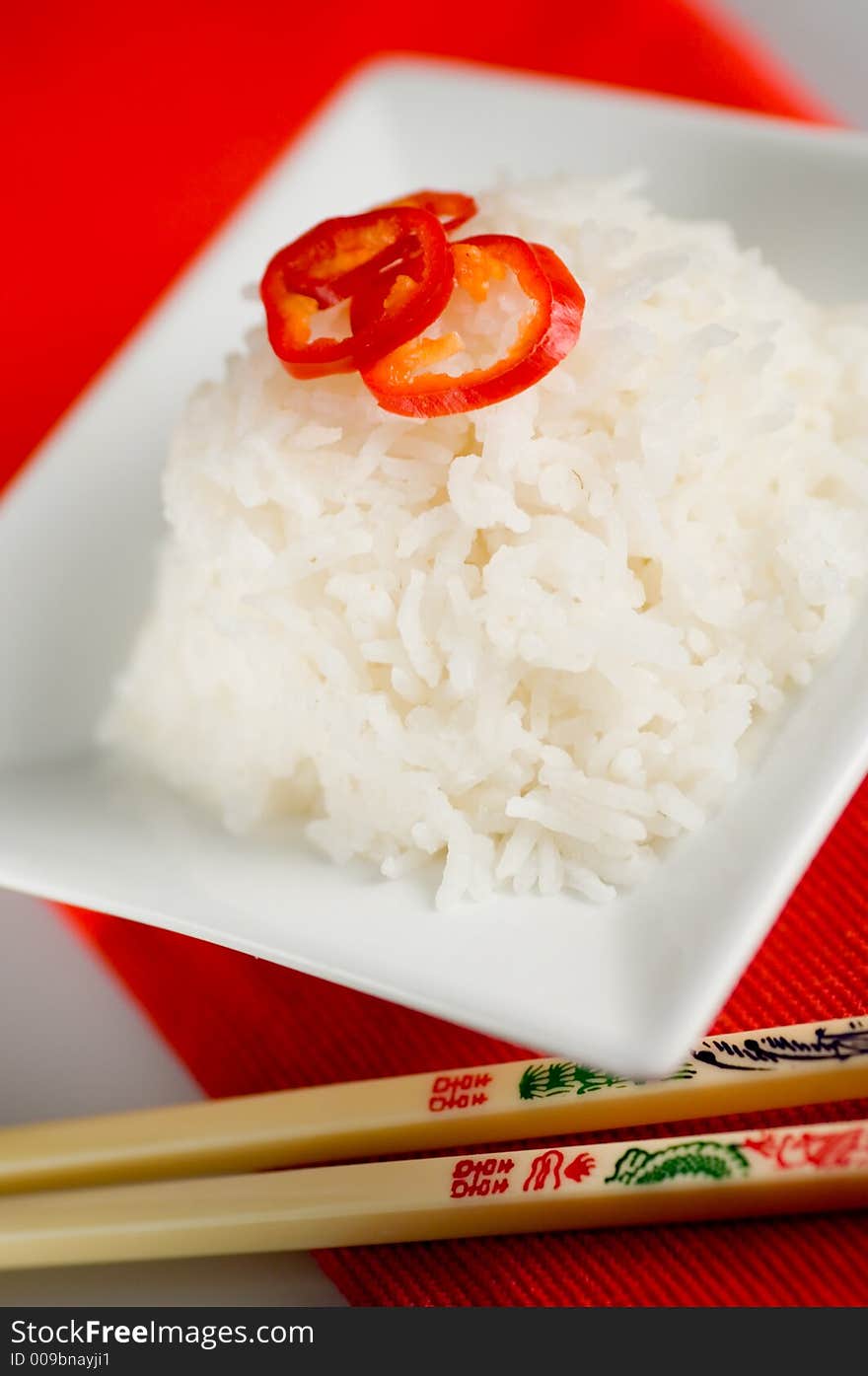 Healthy asian rice dish and chopsticks