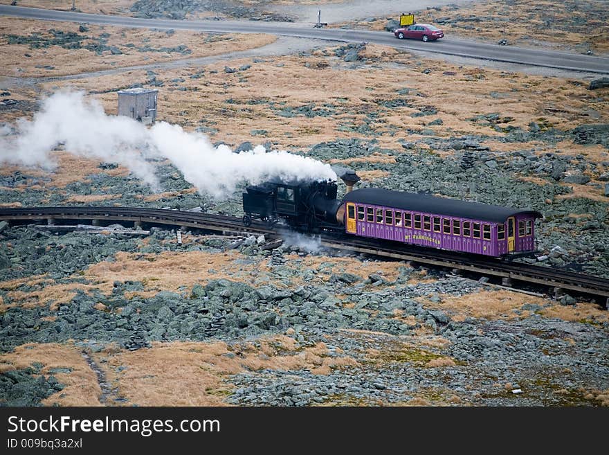 Tourist Train on Mt Washington in a Fall Cloudy Day