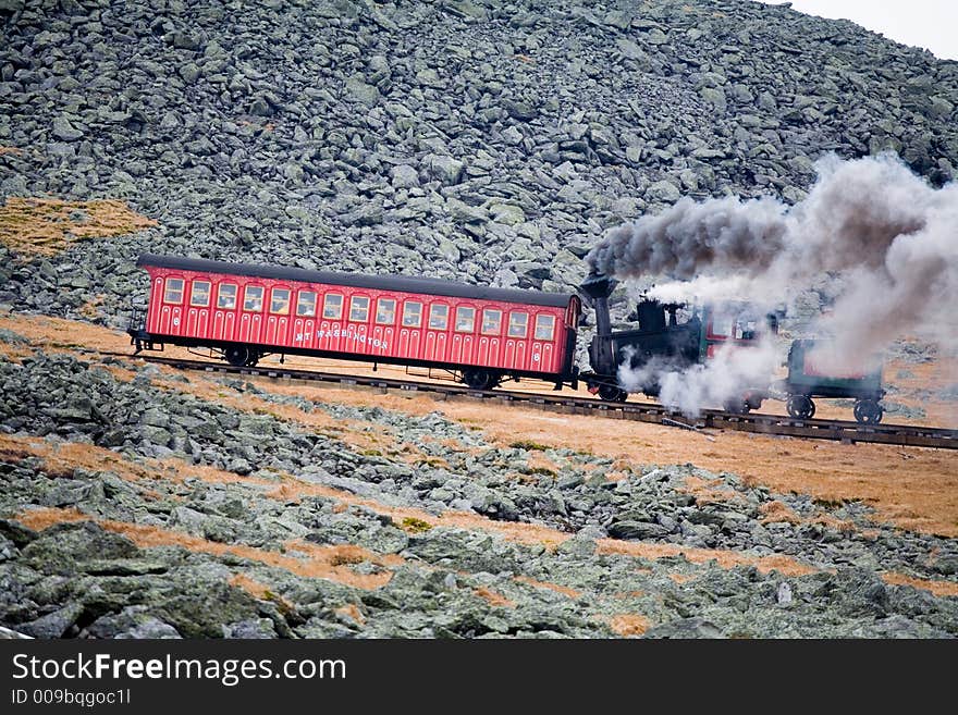 Tourist Train on Mt Washington in a Fall Cloudy Day