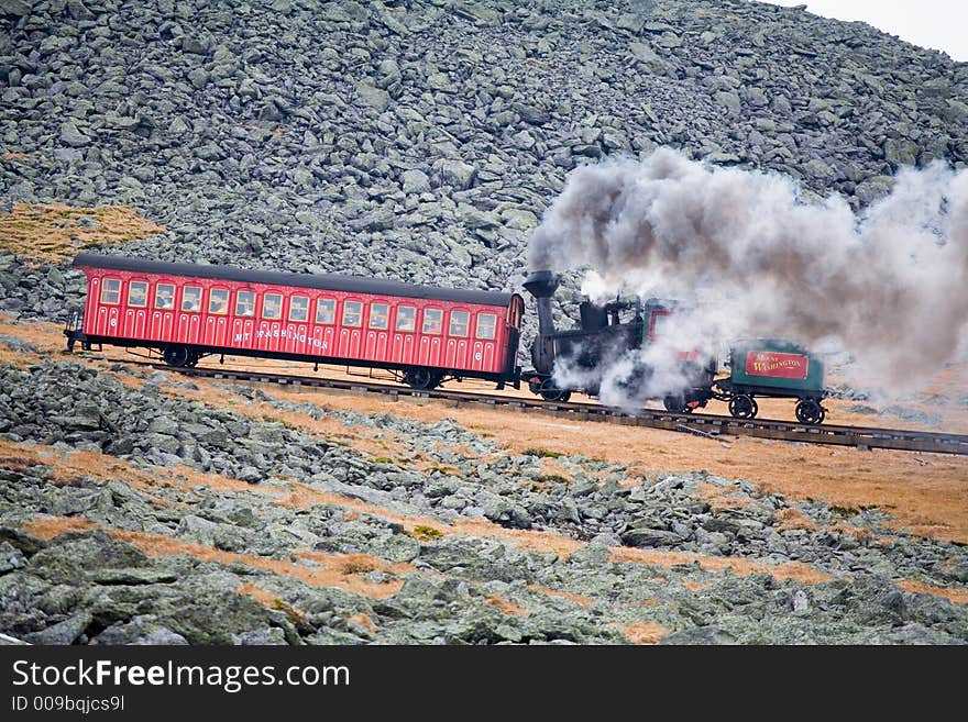 Tourist Train on Mt Washington in a Fall Cloudy Day