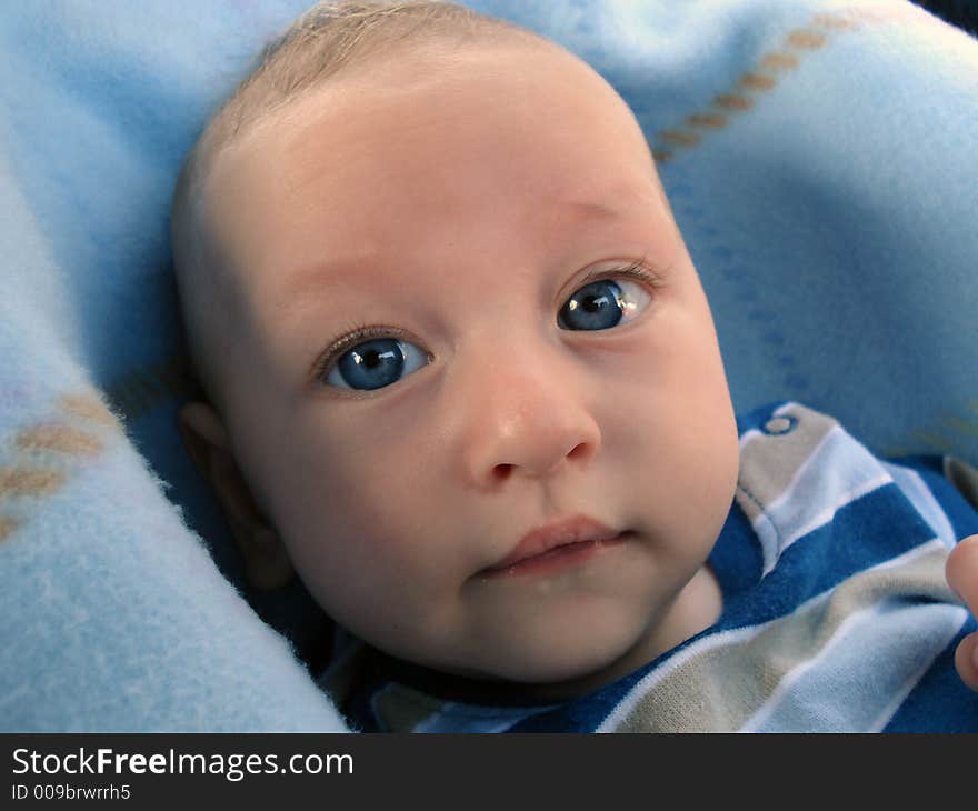 Cute little baby boy looking to camera