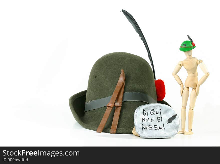 Alpini Hat (the sacred symbol of Italy's elite mountain troops) and skis on a rock. Alpini Hat (the sacred symbol of Italy's elite mountain troops) and skis on a rock.