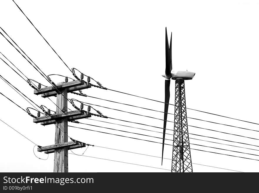 A large wind generator and power lines (B&W). A large wind generator and power lines (B&W).