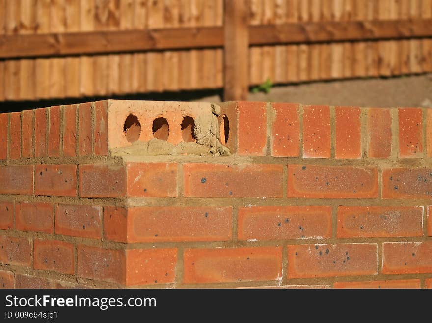 Missing brick on garden wall