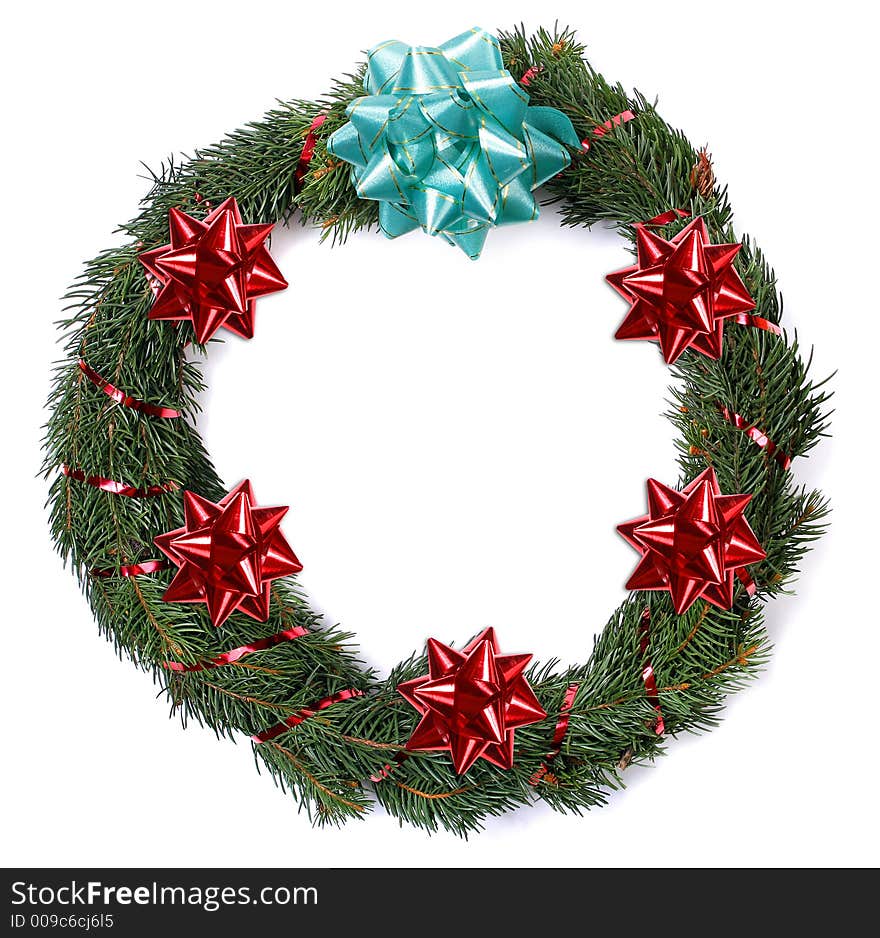 An isolated holiday Christmas wreath over white