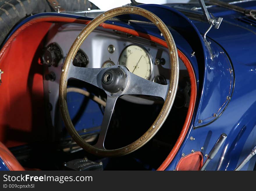 Old wooden wheel on a vintage car