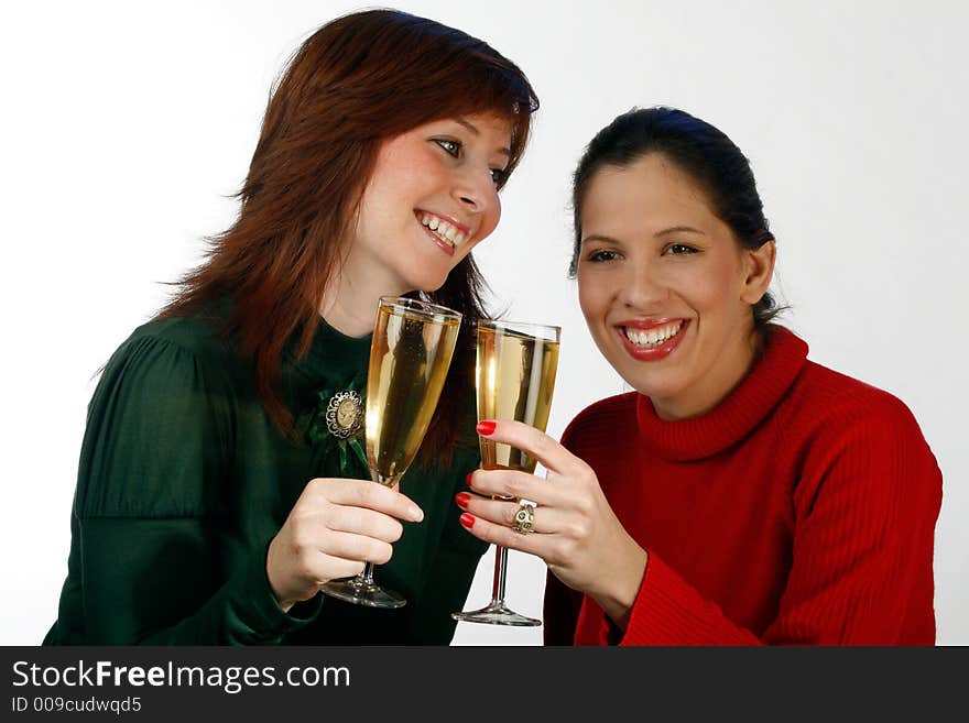 Two women holding  glasses of champagne. Two women holding  glasses of champagne