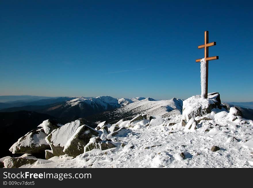 A double cross on the snow-covered top. A double cross on the snow-covered top