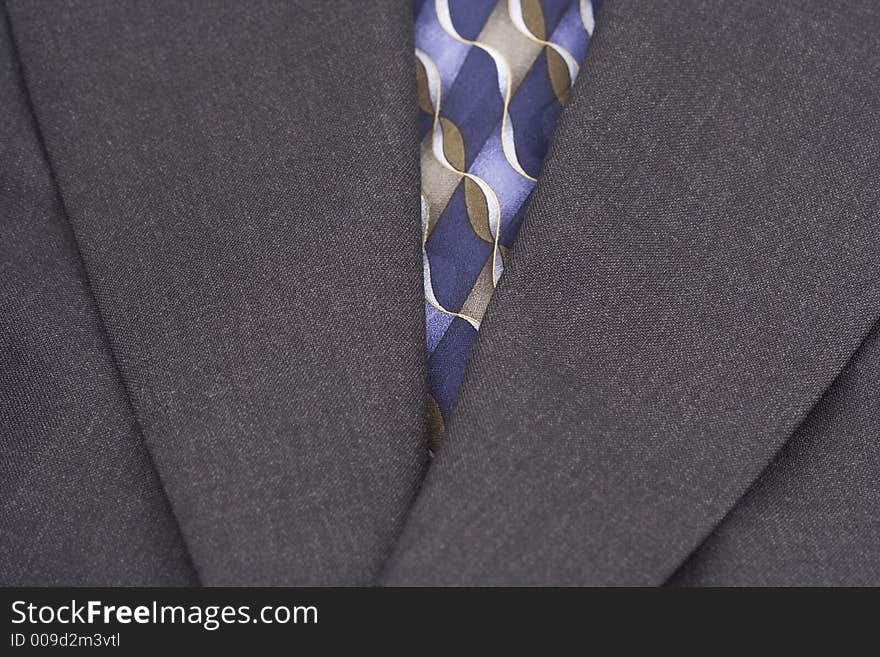 Up close of coat and tie to present a very business and fashion minded photograph. Up close of coat and tie to present a very business and fashion minded photograph.