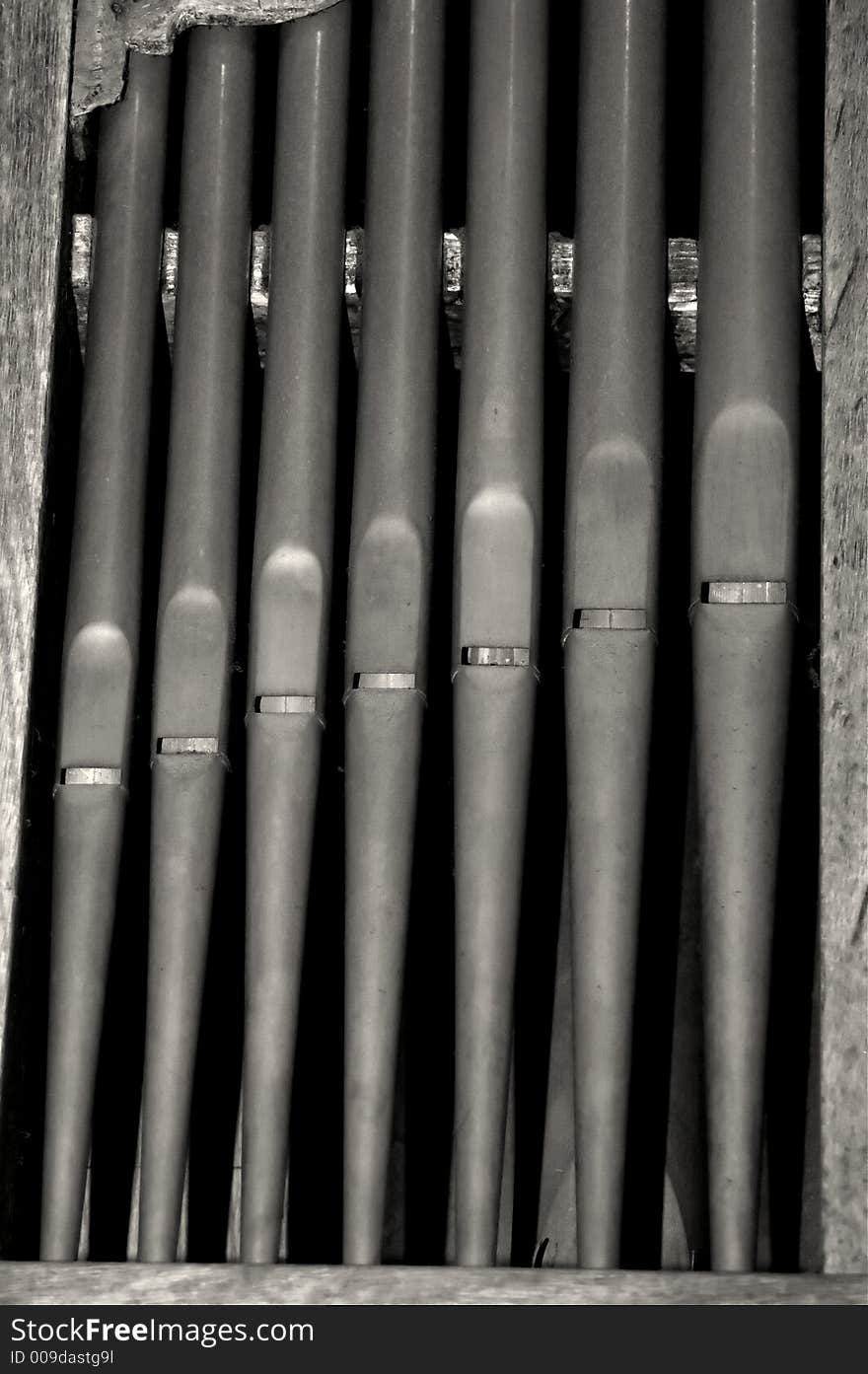 Close up of black and white organ pipes