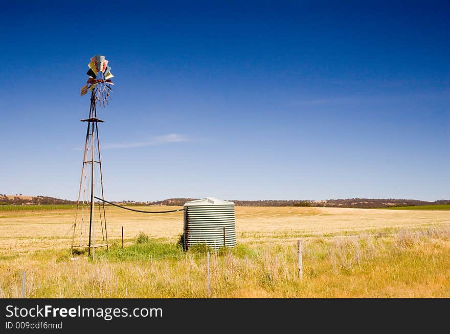 A windmill in the countryside.