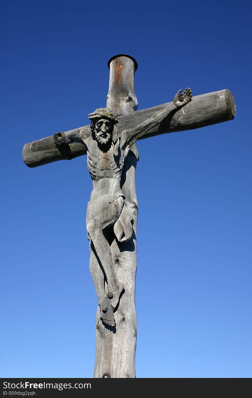 Cross on the peak of a mountain. Interesting wooden structure. Cross on the peak of a mountain. Interesting wooden structure