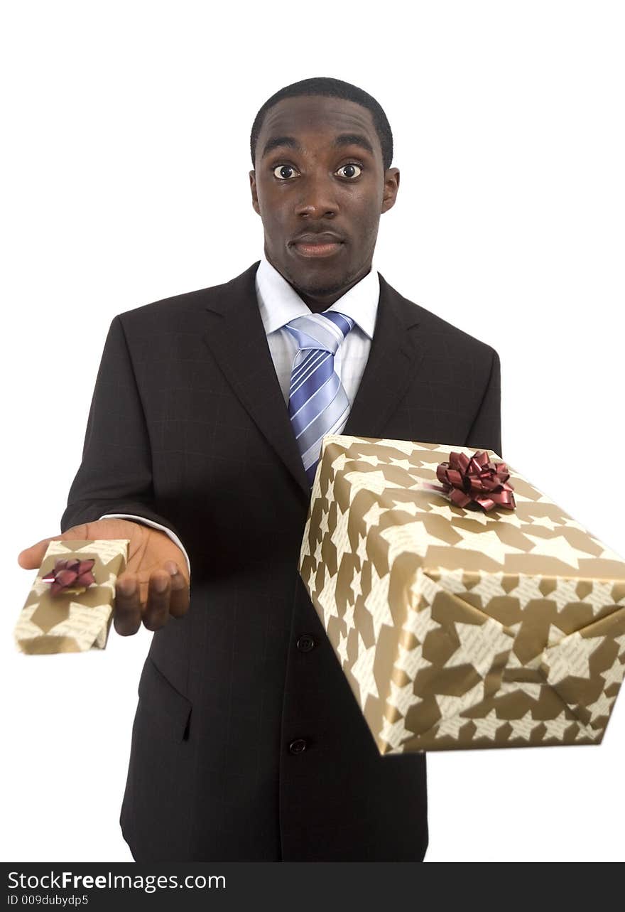 This is an image of a man trying to decided whether to go for the big or small gift. This is an image of a man trying to decided whether to go for the big or small gift.