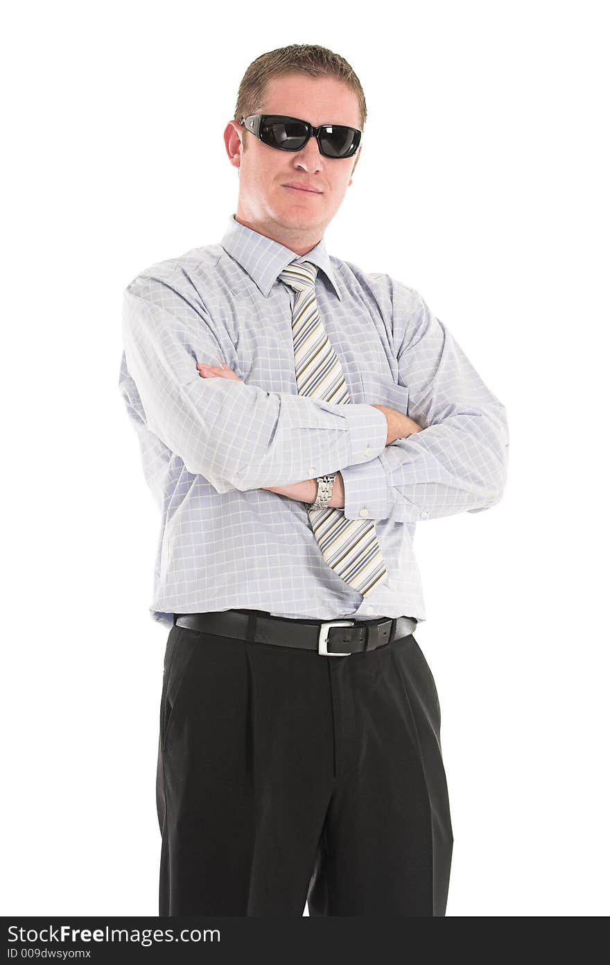 Serious businessman wearing black sunglasses and his arms crossed. Serious businessman wearing black sunglasses and his arms crossed