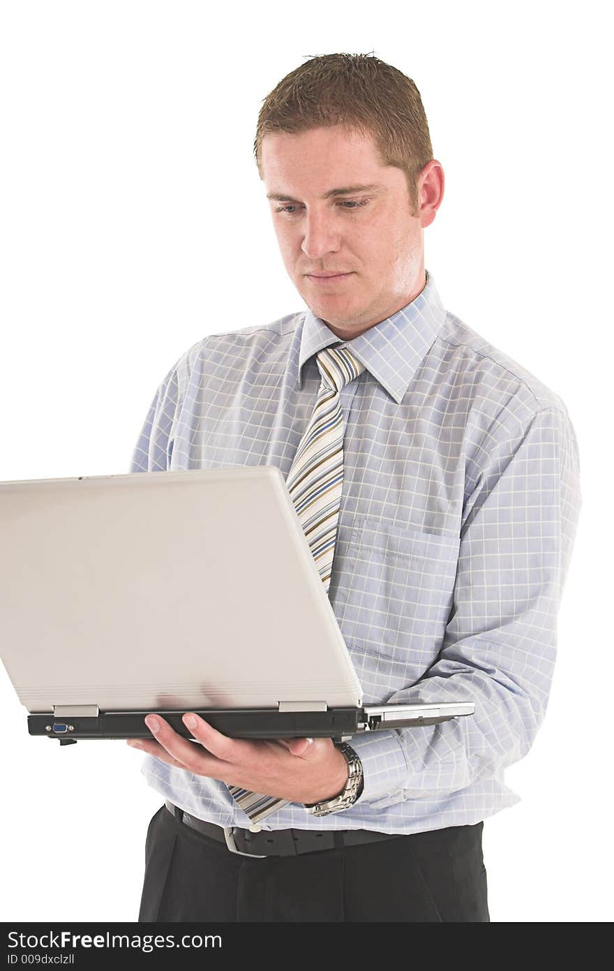 Businessman working on the laptop over white backdrop. Businessman working on the laptop over white backdrop