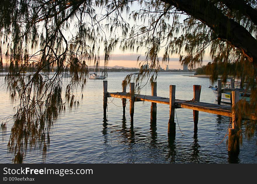 Late afternoon light on a jetty by the water. Late afternoon light on a jetty by the water.