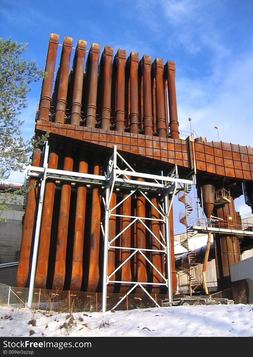 Rusty old industrial building. 
Cooling radiator for smelting industry