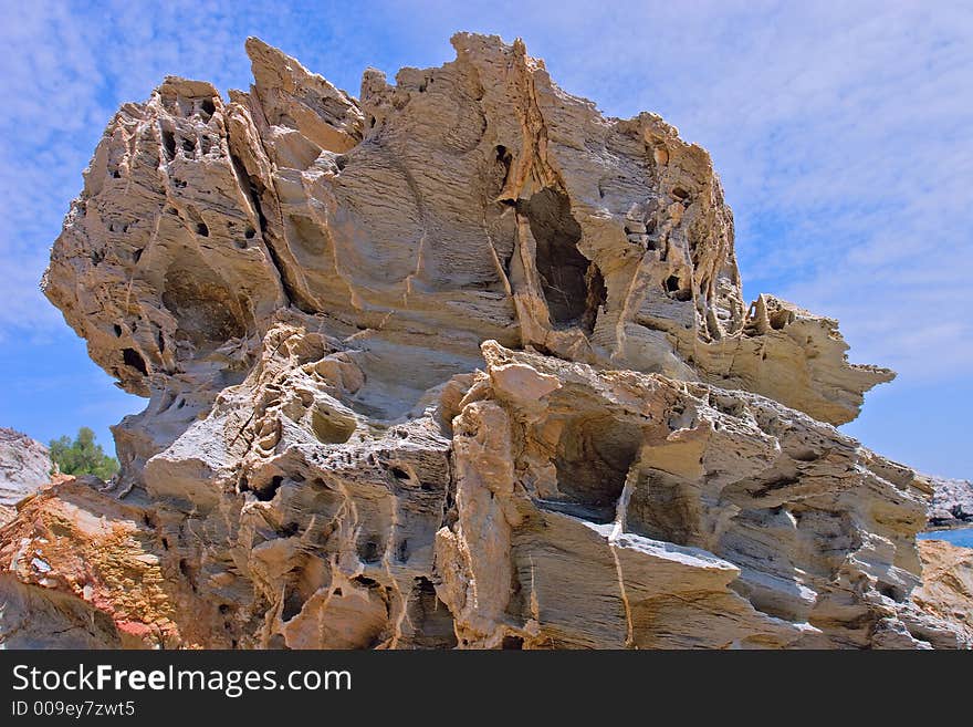 Big rugged rock on a seashore. Big rugged rock on a seashore