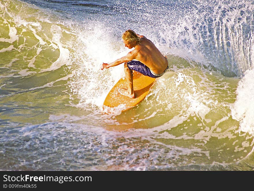 Skim boarder throwing buckets.image shot from a pier