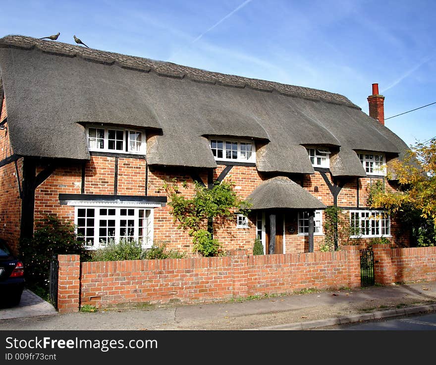 Quaint Thatched wooden framed Village Cottage in a Rural England. Quaint Thatched wooden framed Village Cottage in a Rural England